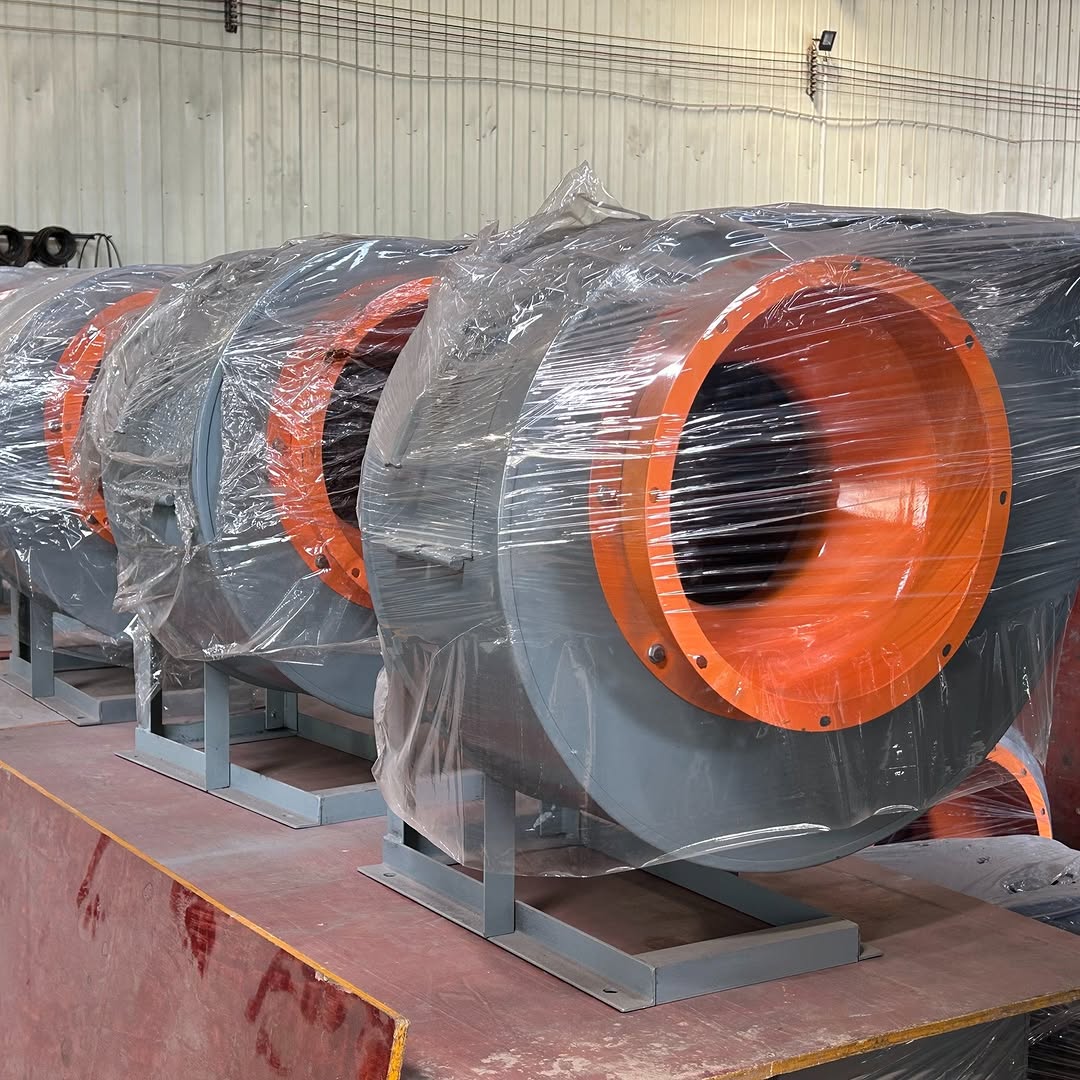 Industrial centrifugal blower with 5.5kW motor and orange inlet, designed for high-pressure industrial ventilation and air movement