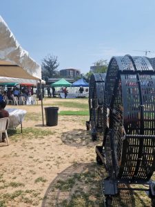 Heavy-duty portable industrial ventilation fan providing cooling and air circulation at an outdoor event tent in Kenya