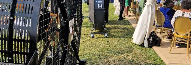 Heavy-duty portable industrial ventilation fan providing cooling and air circulation at an outdoor event tent in Kenya