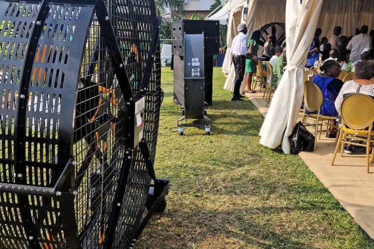 Heavy-duty portable industrial ventilation fan providing cooling and air circulation at an outdoor event tent in Kenya