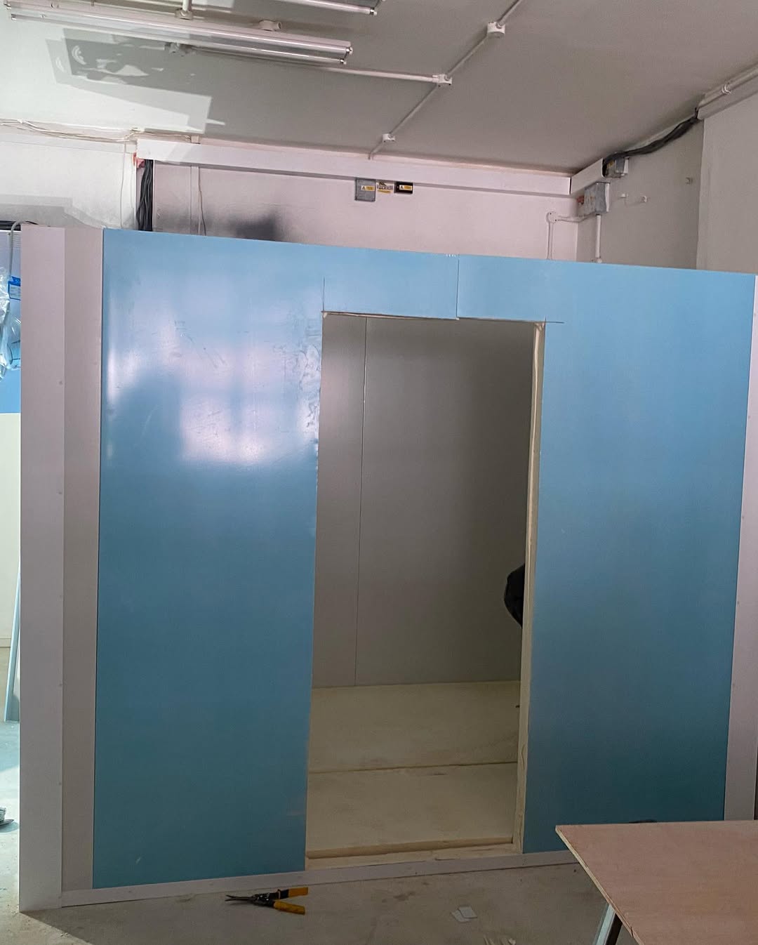 Cold room panel walls with door frame under construction