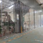 PVC strip curtain installation at an industrial doorway in Kenya