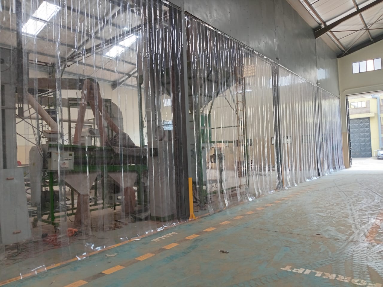 PVC strip curtain installation at an industrial doorway in Kenya